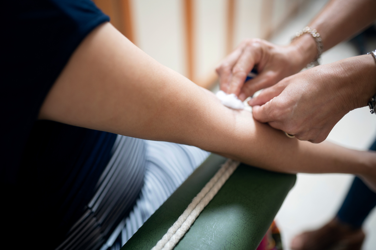 Woman getting a hormone blood test