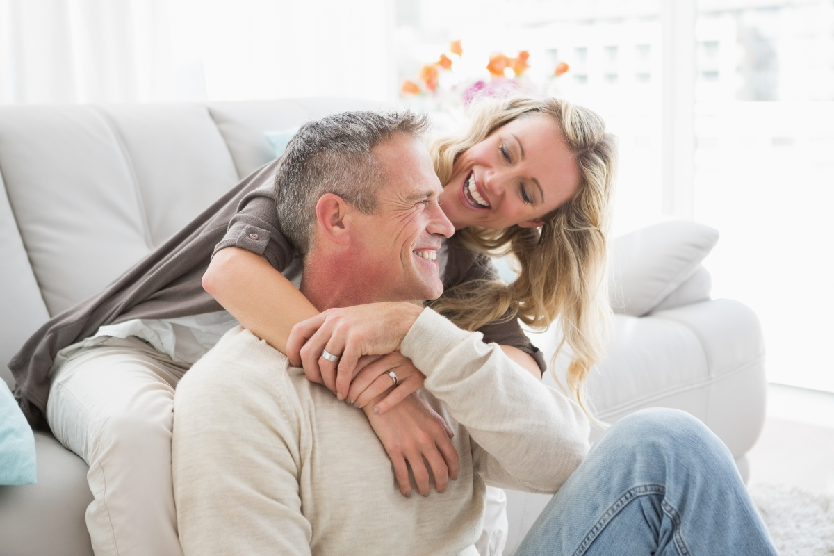 A happy couple hugging who have explored the benefits of BHRT can be an anti-ageing hormone therapy